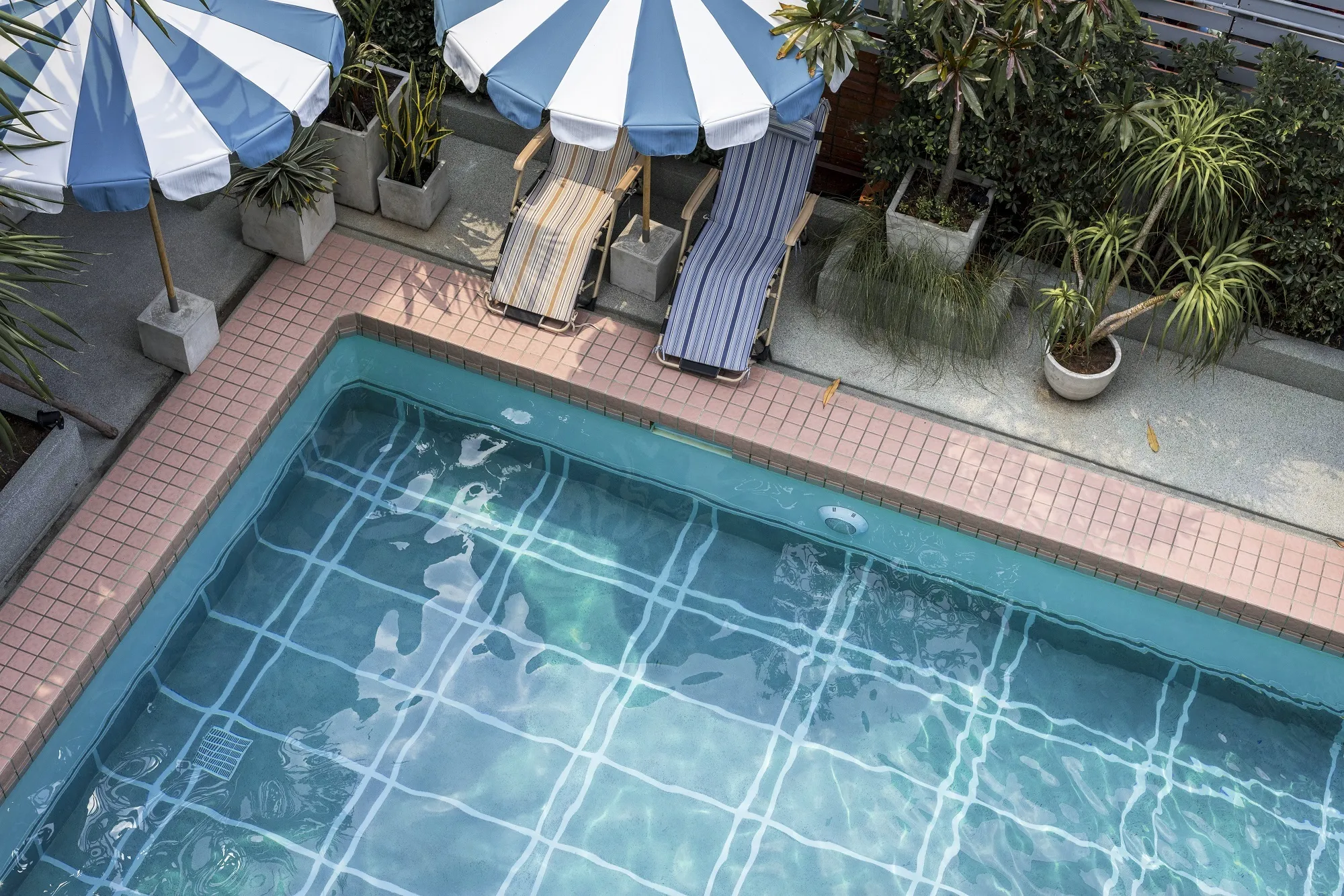 Altaif technician carrying out pool water treatment in Dubai