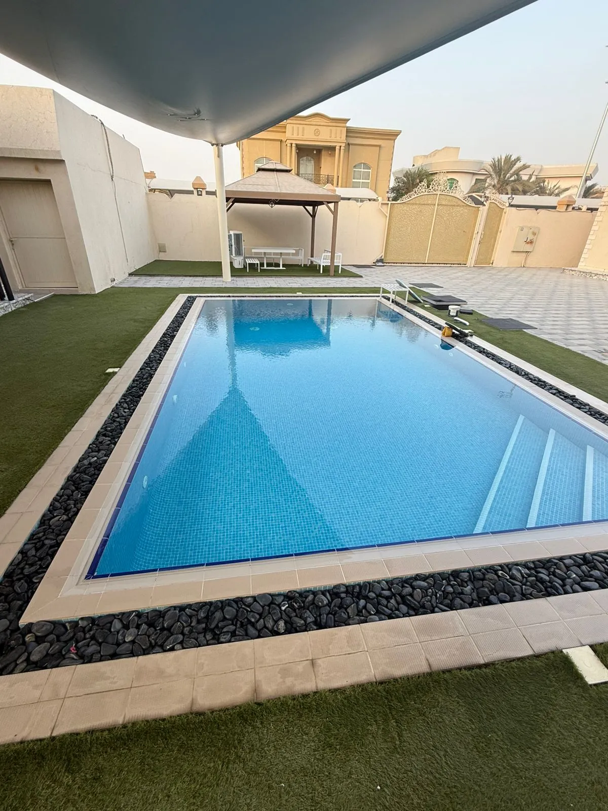 Altaif technician carrying out pool cleaning service in Dubai
