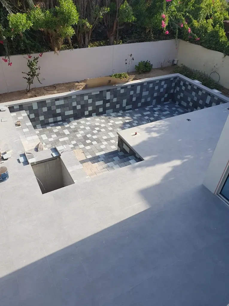 Completed pool tile replacement with clean grout lines in a Dubai villa
