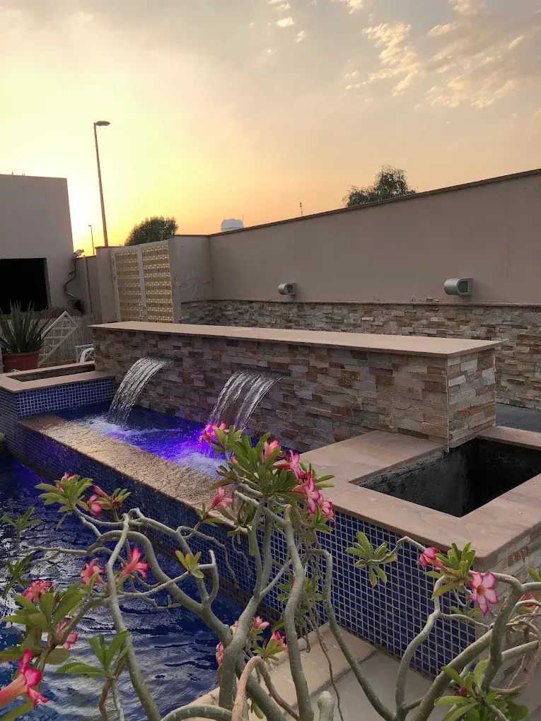 Renovated villa pool at night with lighting on clear water in Dubai