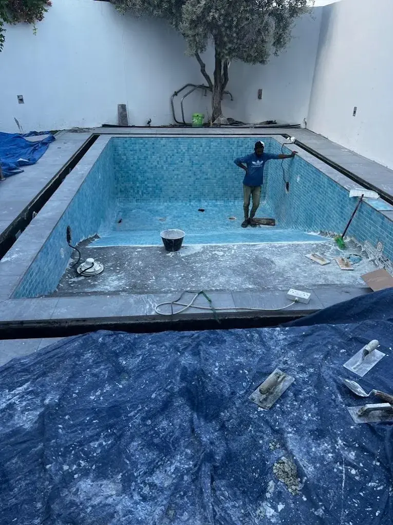 Replaced waterline tiles on a villa pool in Tilal Al Ghaf